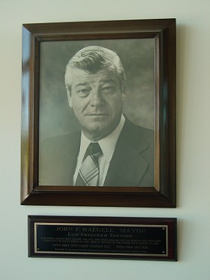 Photograph of John Haegele inside front lobby of East Greenwich Municipal Building