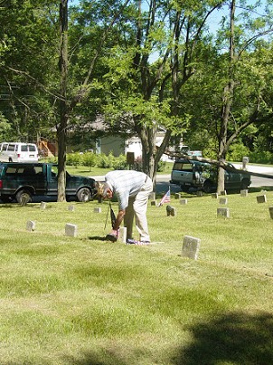 Alvin Smith placing a flag