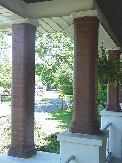 Glazed  rounded brick pillars on the front porch