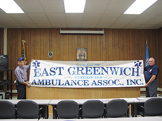 East Greenwich Ambulance Association Inc. banner held by members