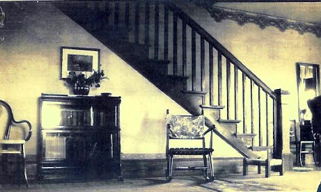 This photograph taken before 1936 shows a stairway that may pre-date the building