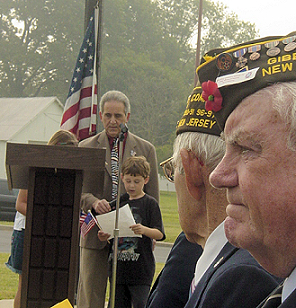 Joshua Meyer, Principal of the Jeffrey Clark School and two of his students offer a flag related presentation.