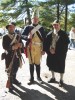 Hessian re-enactor with American colonial soldiers on each side